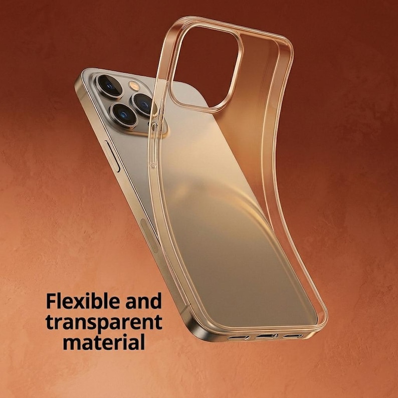 May include: A transparent, flexible phone case is shown, partially covering a gold smartphone. The case allows the phone's design to be visible. The text "Flexible and transparent material" is printed on the lower left.