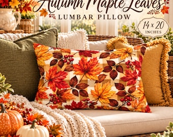 May include: A rectangular lumbar pillow measuring 14 by 20 inches, featuring a pattern of vibrant orange, red, and yellow maple leaves with small red berries over a tan and white checkered background, centered on a sofa with other pillows.