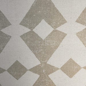 May include: A white fabric with a geometric pattern of brown diamond shapes. The fabric has a textured surface.