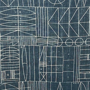 May include: A blue fabric with a white geometric pattern. The pattern is made up of lines, circles, and squares.