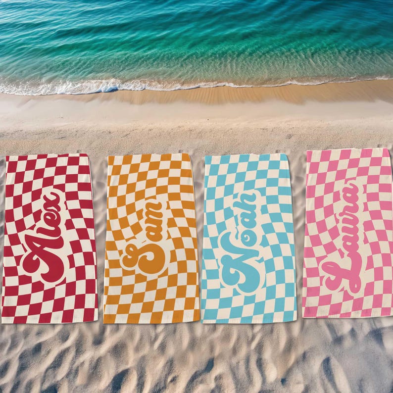 May include: Four beach towels with checkered patterns in red, orange, blue, and pink. Each towel has a name in a retro font: Alex, Sam, Noah, and Laura.