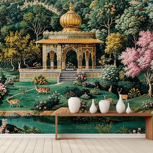 May include: A vibrant mural depicting a lush garden scene with a golden gazebo, deer, and a serene pond. The artwork features a variety of trees, flowers, and a distant hillside, creating a tranquil and picturesque landscape. White vases sit on a wooden table.