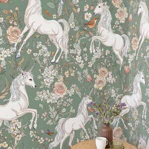 May include: A wallpaper design featuring white unicorns in various poses, set against a green backdrop with floral and botanical elements. The design includes roses, butterflies, and birds, creating a whimsical and enchanting aesthetic.