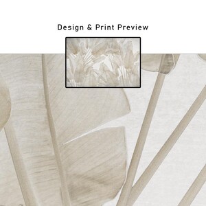 May include: A close-up of a beige and white botanical design. Large, stylized leaves and stems are visible, with a smaller framed preview of the print. The text "Design & Print Preview" is at the top.
