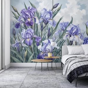 May include: A bedroom interior with a wall mural featuring a cluster of purple and white iris flowers against a blue sky background. The mural is framed by a white trim and a window with a dark curtain. A bed with a white headboard and a gray and white checkered blanket is in the foreground.