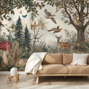 May include: A whimsical forest mural featuring a deer, birds, mushrooms, and butterflies. The mural is painted in a watercolor style with soft colors and details. The mural is displayed on a wall in a living room setting with a couch and a vase.