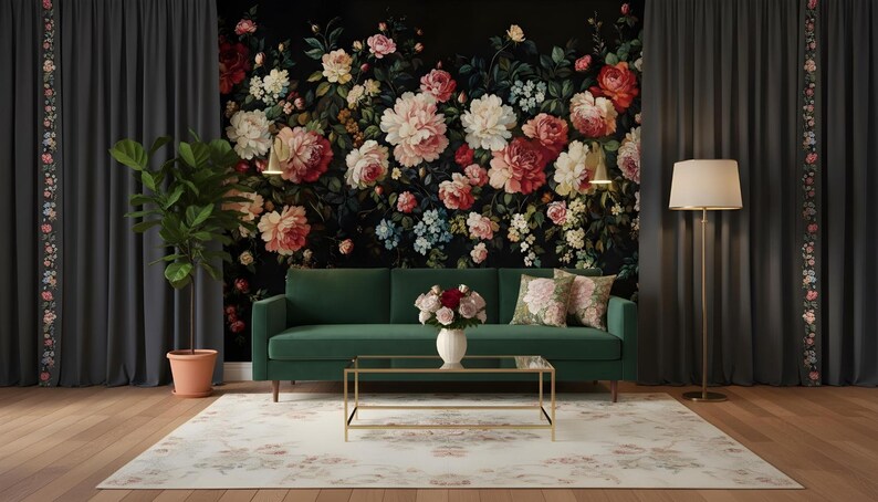 May include: A living room scene featuring a dark green sofa, a gold-framed coffee table, and a floral rug. The backdrop is a floral wallpaper with pink and red roses. Gray curtains frame the scene, and a potted plant and floor lamp add to the decor.