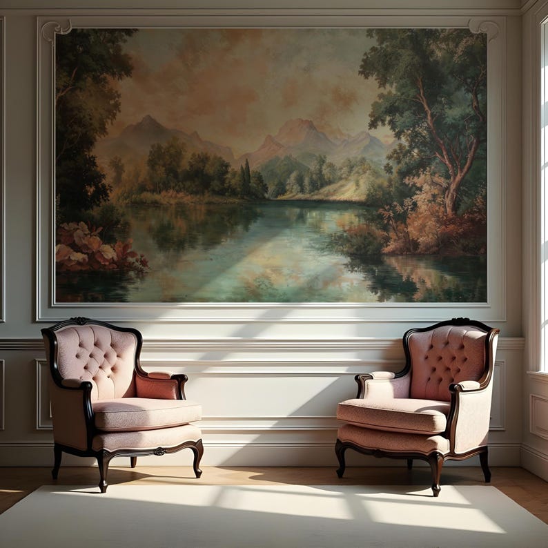 May include: Two pink upholstered armchairs with dark wood frames sit in front of a large painting depicting a lake and mountains in a landscape setting.