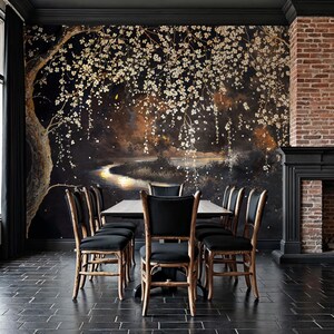 May include: A dining room with a dark, floral mural as a backdrop. A rectangular table is surrounded by six black-cushioned chairs with light-colored wooden frames. A brick fireplace and black trim complete the room.