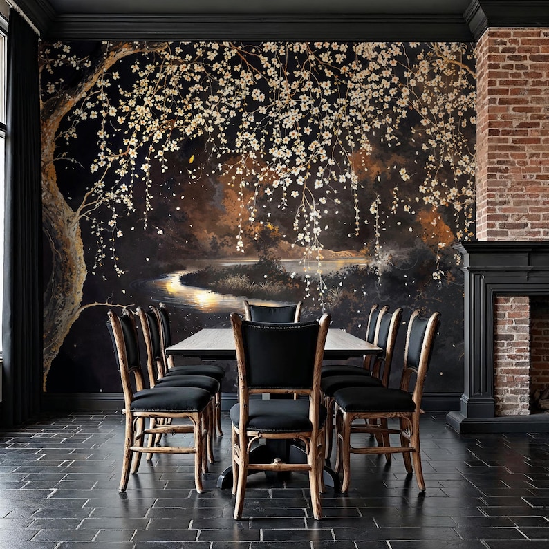 May include: A dining room with a dark, floral mural as a backdrop. A rectangular table is surrounded by six black-cushioned chairs with light-colored wooden frames. A brick fireplace and black trim complete the room.