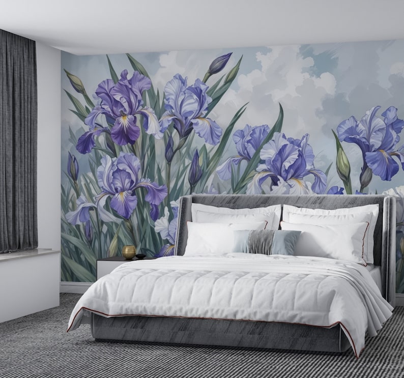 May include: A white bed with a gray headboard and a white comforter. The bed is in front of a wall with a mural of purple irises on a light blue background.