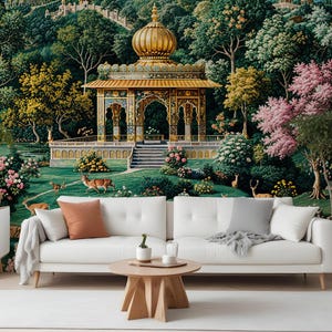 May include: A white sofa with throw pillows and a wooden coffee table is in front of a mural. The mural depicts a golden domed structure with intricate details, surrounded by lush greenery, trees, and deer. The scene evokes a serene, natural landscape.