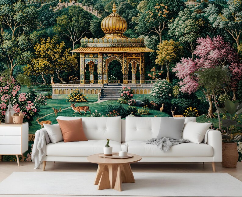 May include: A white sofa with throw pillows and a wooden coffee table is in front of a mural. The mural depicts a golden domed structure with intricate details, surrounded by lush greenery, trees, and deer. The scene evokes a serene, natural landscape.
