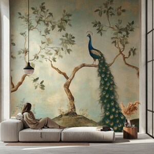 May include: A vintage-style wallpaper mural featuring a peacock with a blue and green tail perched on a branch of a tree with green leaves. The wallpaper is painted on a light blue background with a light brown tree trunk.