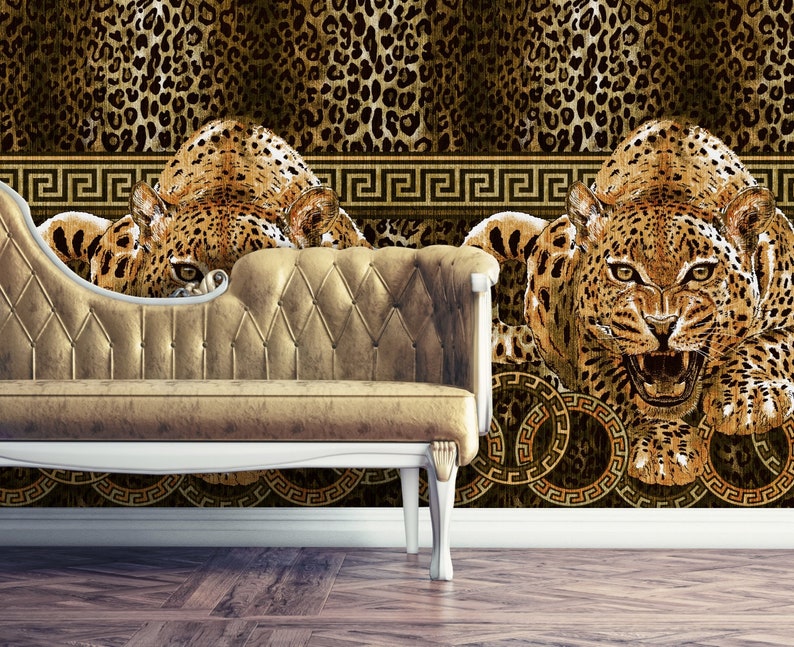 May include: A gold and brown patterned wallpaper with a repeating design of a leopard print. The wallpaper features a Greek key border and a large image of a leopard with its mouth open.