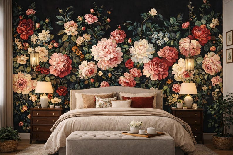 May include: A bedroom with a floral wallpaper featuring large, colorful flowers in shades of red, pink, and white against a dark background. The bed has a beige comforter and pillows. Two lamps flank the bed.