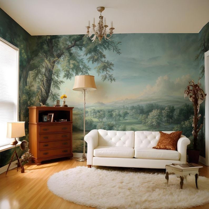 May include: A white leather sofa with tufted buttons sits in a living room with a large mural depicting a landscape scene. The mural features trees, hills, and a blue sky. A wooden dresser with drawers is to the left of the sofa, and a white fluffy rug is in front of the sofa.
