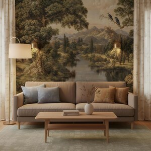 May include: A living room scene featuring a beige sofa, wooden coffee table, and a landscape mural. Decorative pillows in blue and gold tones add color. A floor lamp and patterned rug complete the cozy, inviting space. The mural depicts a serene river scene.