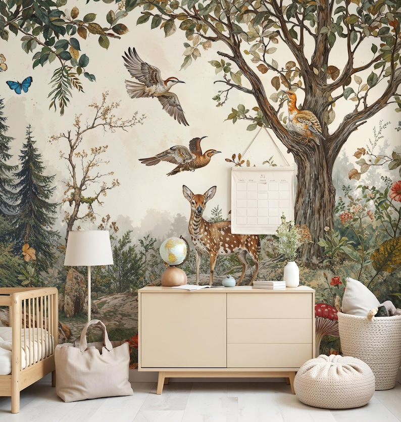 May include: A nursery room with a woodland mural featuring a deer, birds, and trees. The mural is on a wall behind a dresser, a crib, and a floor lamp. There is a woven basket with a red and white mushroom on the floor.