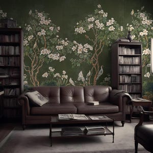 May include: A dark green wallpaper with a floral design featuring white flowers and birds. The wallpaper is in a living room with a brown leather sofa, a coffee table, and bookshelves.