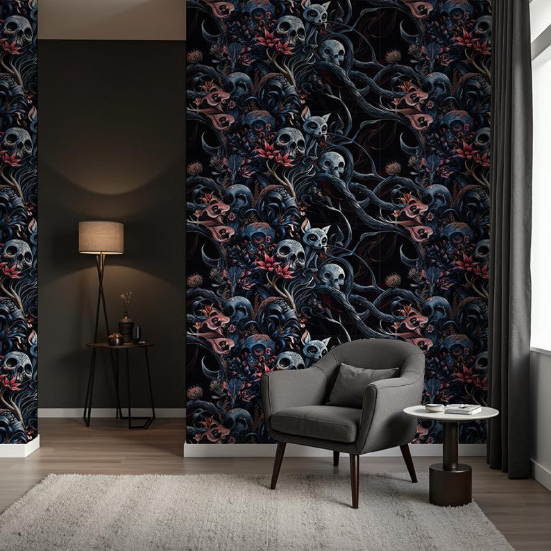 May include: A dark blue and black wallpaper with a repeating pattern of skulls, flowers, and vines. The wallpaper is shown in a room with a gray armchair and a side table.