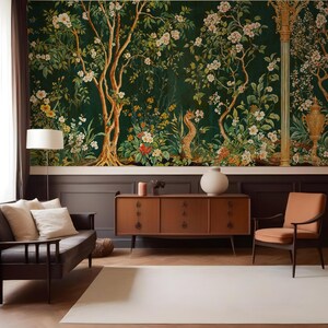 May include: A living room interior with a dark green floral wallpaper featuring a stylized bird and a column. The room has a brown leather sofa, a wooden cabinet, and a brown armchair.
