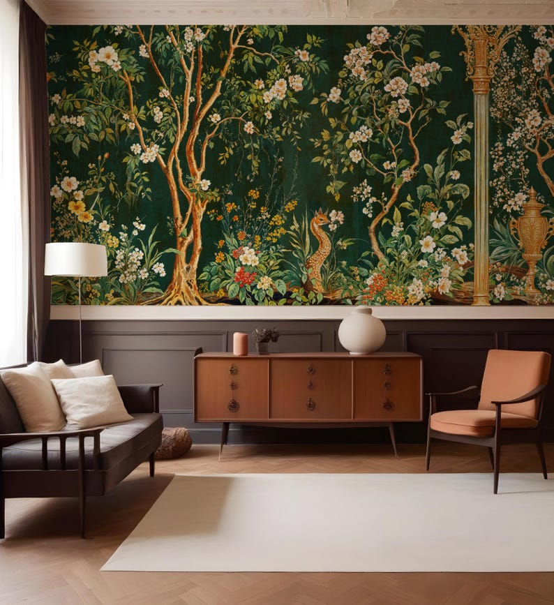 May include: A living room interior with a dark green floral wallpaper featuring a stylized bird and a column. The room has a brown leather sofa, a wooden cabinet, and a brown armchair.