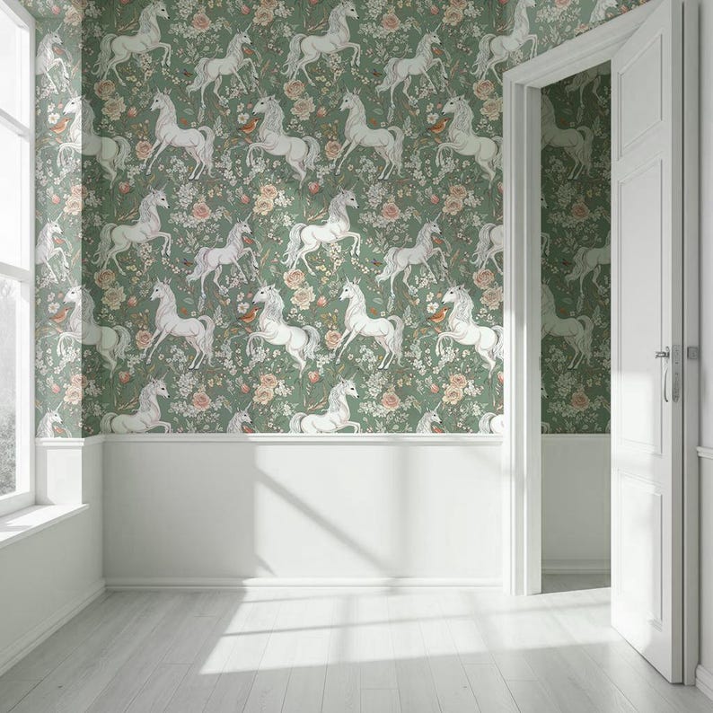 May include: A room with walls covered in a green floral wallpaper featuring white unicorns. The wallpaper is paired with white wainscoting and a white door frame. The room has a white floor and a window on the left side.