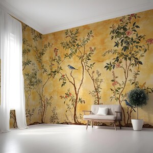 May include: A yellow wallpaper with a floral pattern and blue birds. The wallpaper is in a room with a white sofa and a potted plant.