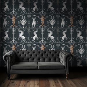 May include: A dark gray sofa with button tufting sits in front of a wall covered in a black and white wallpaper featuring a repeating pattern of stylized horses, deer, and figures. The wallpaper has a medieval or renaissance aesthetic.