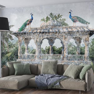 May include: A decorative wall mural depicting a classical pavilion with two peacocks. The mural is set against a backdrop of lush greenery. A comfortable sectional sofa with throw pillows is in front of the mural.