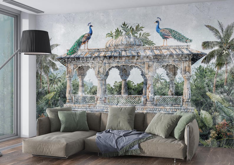 May include: A decorative wall mural depicting a classical pavilion with two peacocks. The mural is set against a backdrop of lush greenery. A comfortable sectional sofa with throw pillows is in front of the mural.
