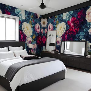 May include: A bedroom with a floral wallpaper in shades of pink, white, and dark blue. The room features a black bed frame with white bedding, a dark dresser, a large mirror, and a white rug.