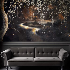 May include: A dark, moody mural depicting a serene landscape with a winding river reflecting golden light. White blossoms cascade from a tree, creating a dreamy, ethereal atmosphere. A gray tufted sofa sits below the mural.