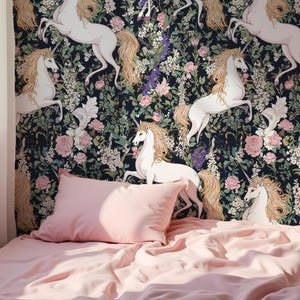 May include: A pink bed with a white unicorn wallpaper featuring a floral pattern. The wallpaper has a dark blue background with white unicorns and pink, white, and purple flowers.