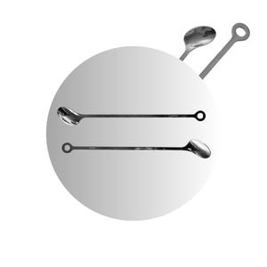 May include: Two silver cocktail spoons with rounded ends and circular handles. The spoons are laying on a white background.