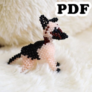 May include: A beaded dog figurine with black, white, and red beads. The dog is standing on a white fluffy surface.