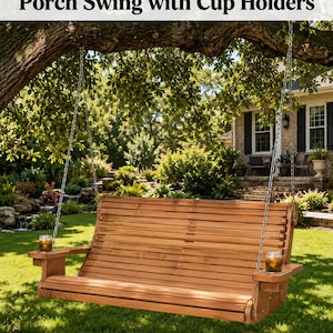 May include: A 6' casual roll back porch swing made of light brown wood, featuring a slatted backrest and seat, suspended by metal chains. The swing includes two integrated armrest cup holders, each containing a glass with a brown beverage.