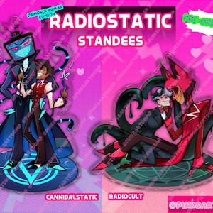 May include: Two acrylic standees featuring animated characters. The left standee shows a television-headed figure and a person in a red vest. The right standee depicts two figures in red and black attire. Text includes RADIOSTATIC STANDEES.