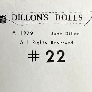 May include: Black and white image of a sewing needle and thread with the text "Dillon's Dolls" and "© 1979 Jane Dillon All Rights Reserved # 22".