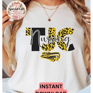May include: A white t-shirt featuring the text TJC Nursing in a mix of solid black and yellow leopard print lettering. Below the text is a yellow and black graphic of a profile of a person wearing a headband. The shirt also displays a circular logo.