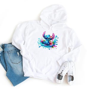 May include: White hoodie with a blue Stitch character wearing flowers and surrounded by blue and green water splashes.