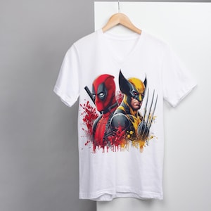 May include: White t-shirt with a graphic print of Deadpool and Wolverine. The graphic is in a comic book style with red, yellow, and black colors.