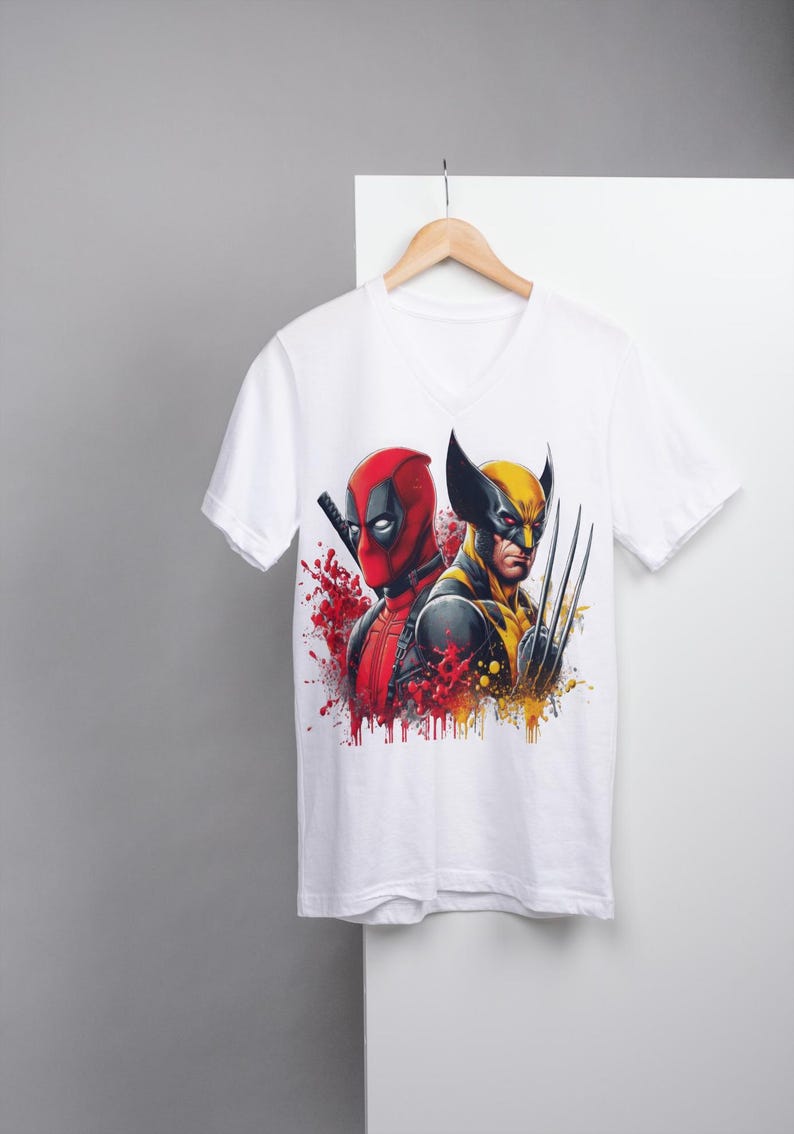May include: White t-shirt with a graphic print of Deadpool and Wolverine. The graphic is in a comic book style with red, yellow, and black colors.