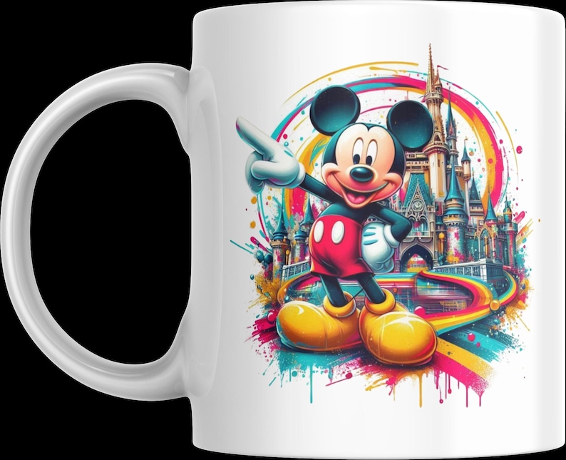 May include: White ceramic mug featuring a colorful illustration of Mickey Mouse pointing towards a castle. Mickey is wearing red shorts, yellow shoes, and white gloves. The background includes a rainbow-colored design.