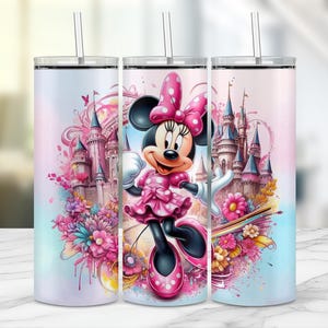 May include: Three stainless steel tumblers with a pink and blue watercolor design featuring a cartoon image of Minnie Mouse in front of a pink castle. The tumblers have a straw and a lid.