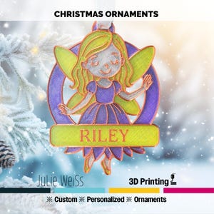 May include: A 3D-printed Christmas ornament with a fairy design and the name "RILEY". The fairy has green hair and wings, a purple dress, and is set against a blurred winter background. The text "CHRISTMAS ORNAMENTS" is at the top.