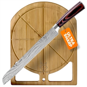 May include: A serrated bread knife with a Damascus steel blade featuring a wavy pattern and a dark wood handle with red accents. An orange tag attached to the bolster reads ULTRA SHARP. The knife is positioned over a round bamboo cutting board.