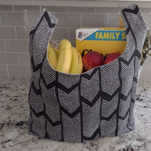 Junipermarketplace bags haul what you need.  This bag will hold double or more  what a plastic grocery bag can.