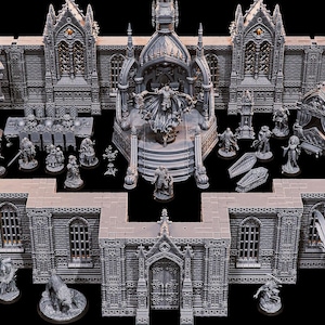 Puede incluir: Una colección de piezas de arquitectura gótica en miniatura grises, que incluyen edificios, estatuas y figuras. El conjunto presenta un trono central con una figura, muros y elementos decorativos, creando una escena de fantasía detallada.